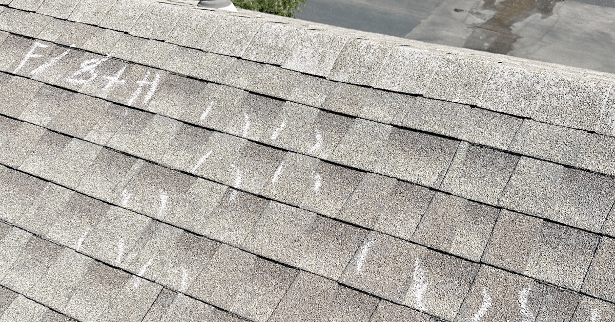 A homeowner is using a flashlight to conduct a thorough inspection of their interior after a hail storm, looking for visible signs of hail damage, such as water stains and damaged roofing materials. This careful examination is crucial for identifying potential hazards and addressing any issues related to the storm's impact on the roof's integrity.