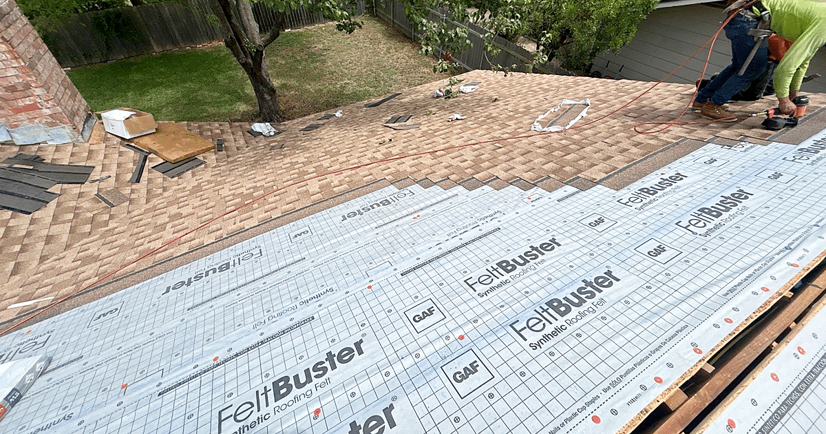 A professional roofer is carefully installing asphalt shingles on a residential home, demonstrating proper installation techniques to ensure a correctly installed roof that maximizes the roof's lifespan. This attention to detail helps prevent premature roof failure and maintains the roof's integrity.