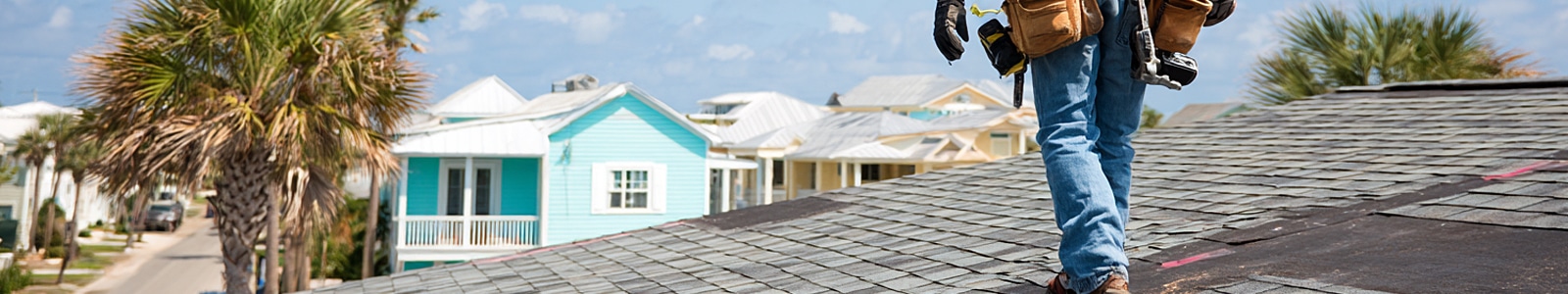 Professional roofer repairing a residential roof in coastal Corpus Christi, Texas.