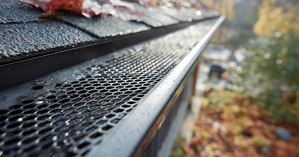 Installed gutter guard on home gutter system reducing clogged gutters and debris buildup to ensure proper drainage and protect roof longevity